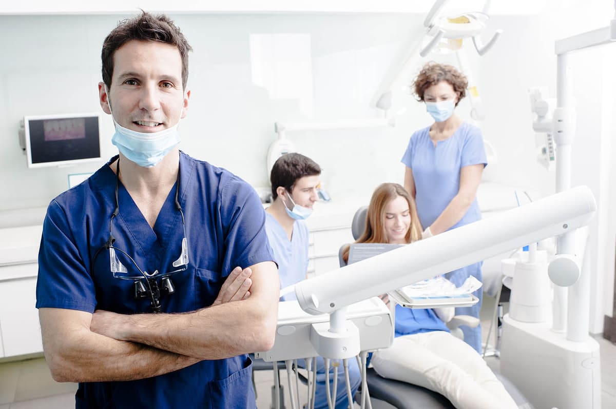 A patient smiling comfortably in the dental chair at DK Dental Care in Hales Corners