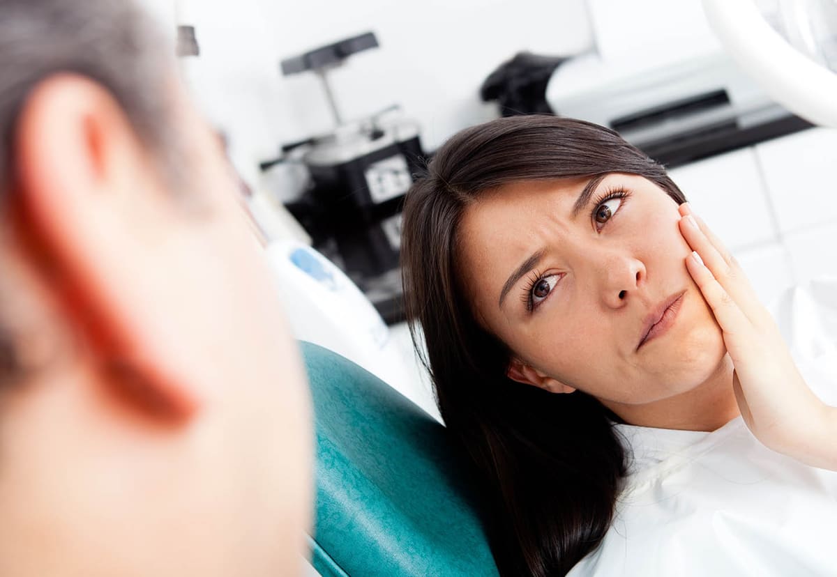 A patient receiving prompt, gentle emergency dental care